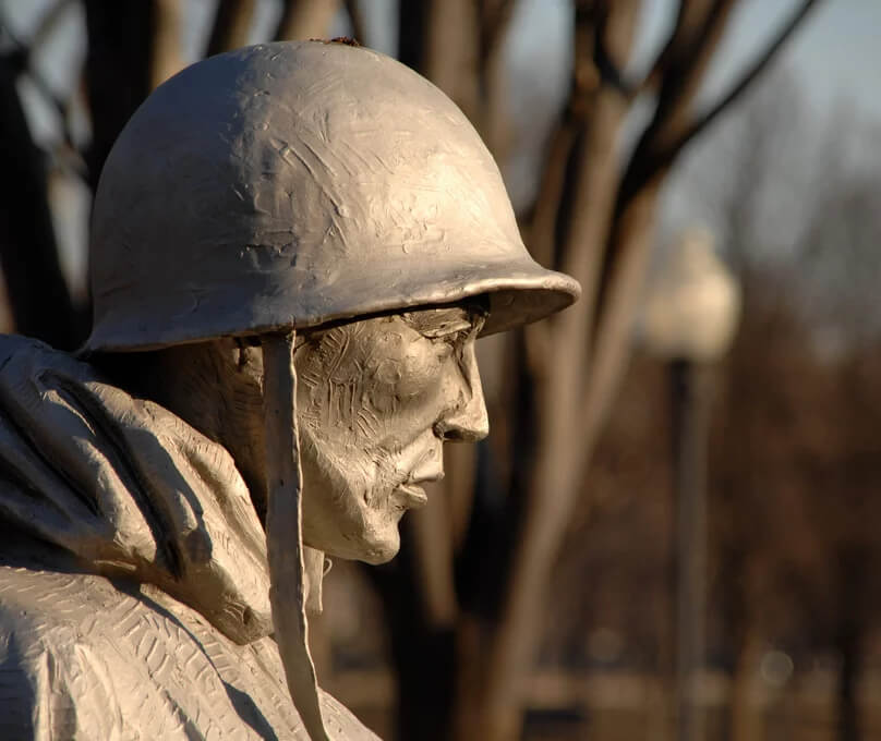 Profile of a statue of a soldier from a memorial in D.C.