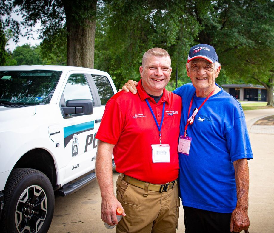 Honor Flight of the Ozarks Flight Coordinator with a veteran in Washington, D.C.