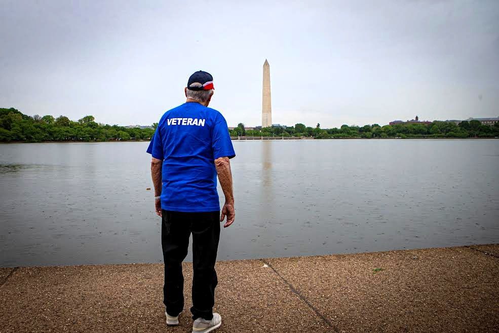 Veteran looking across the Tidal Basin at the Washington Monument