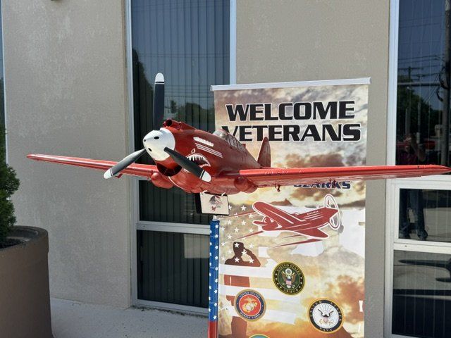 Ozark's RC Warthog plane in front of the Welcome Veterans banner