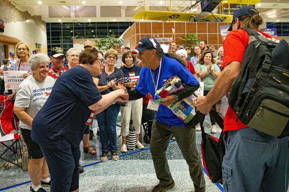 Veteran greeted by a cheering crowd at his welcome home celebration