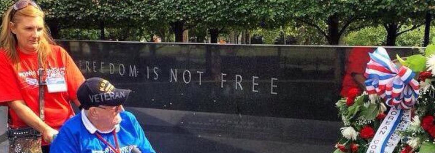 Honor Flight Veteran shaking hands with a civilian