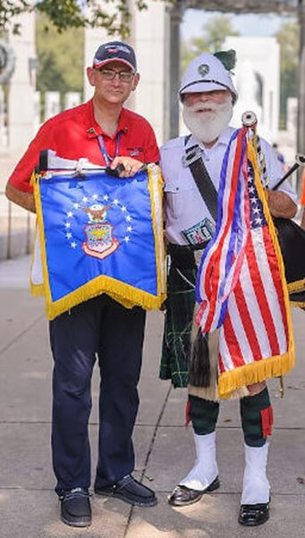 Veterans standing at memorial