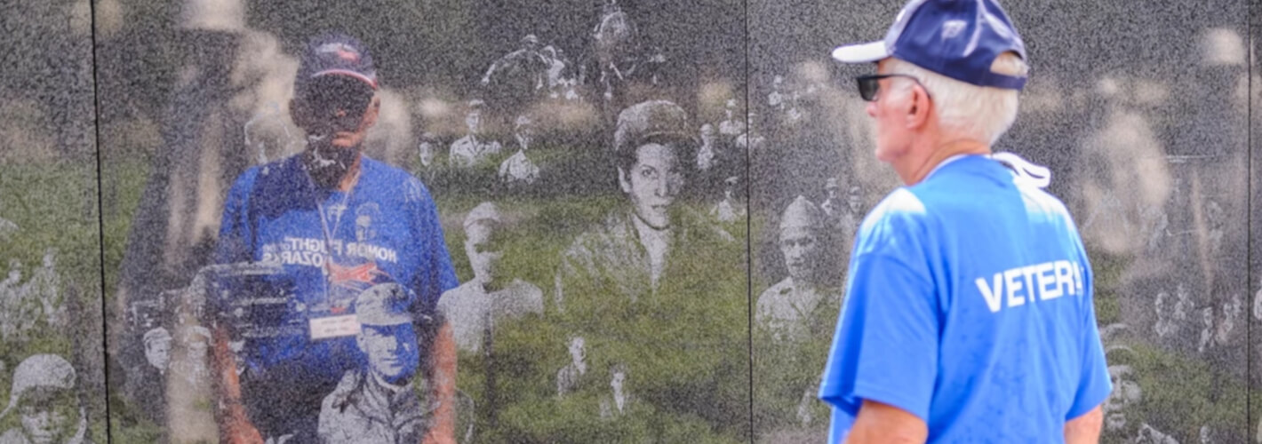 Honor Flight Veteran shaking hands with a civilian